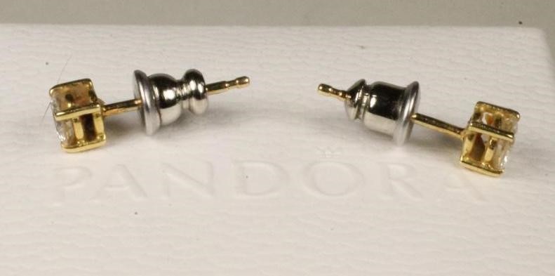 A PAIR OF DIAMOND EAR STUDS Image