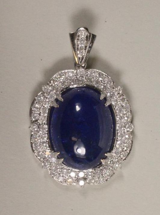 A TANZANITE AND DIAMOND PENDANT Image