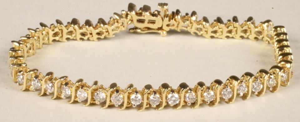 A DIAMOND TENNIS BRACELET Image