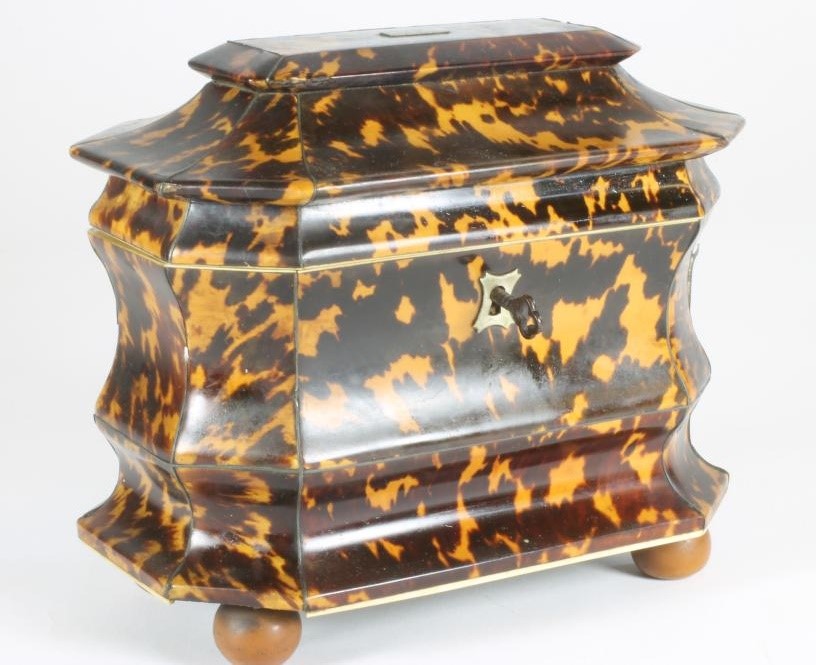 A GEORGIAN TORTOISESHELL TEA CADDY of sarcophagus form Image