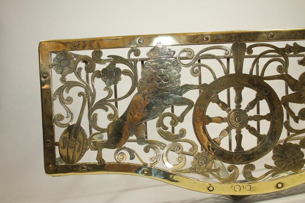 A GEORGIAN BRASS AND IRON FOOTMAN Image