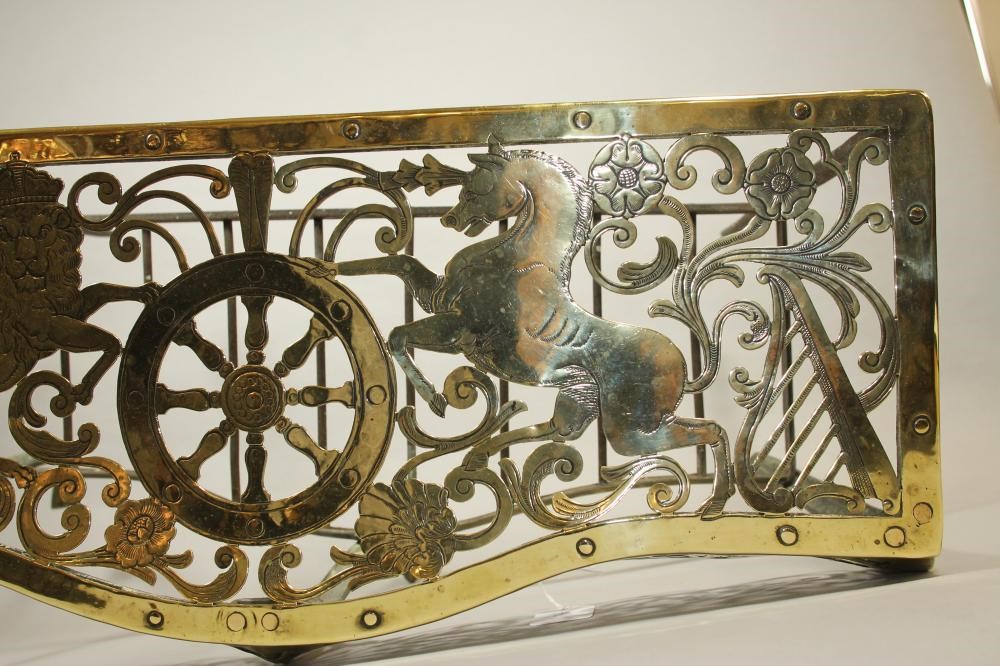 A GEORGIAN BRASS AND IRON FOOTMAN Image