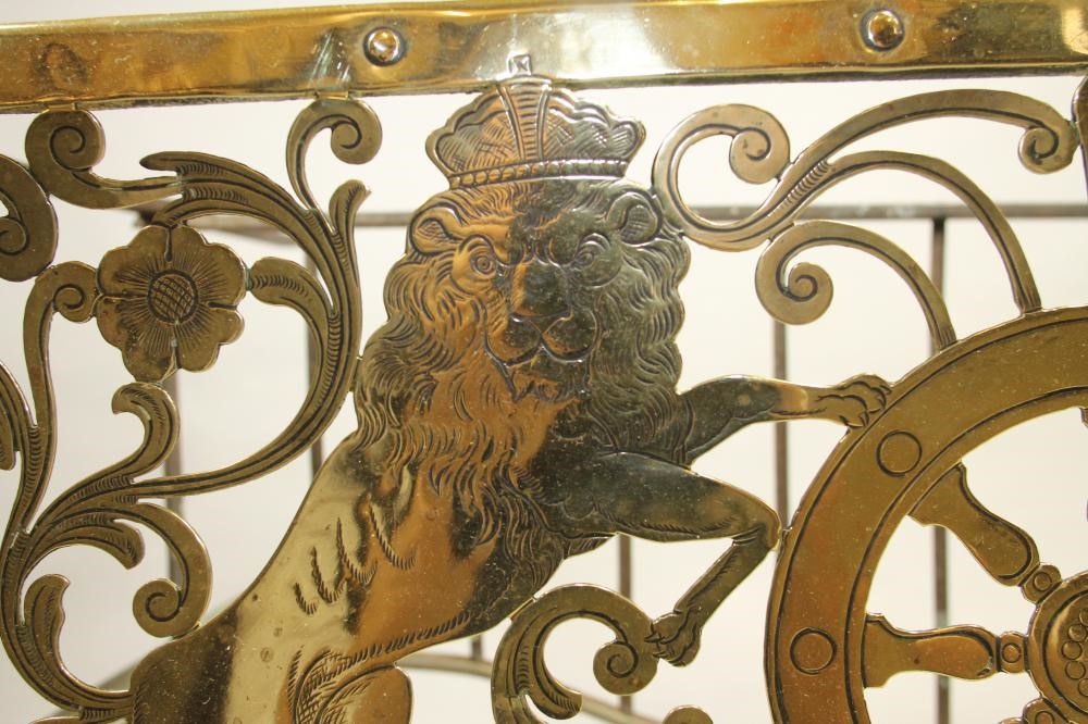 A GEORGIAN BRASS AND IRON FOOTMAN Image