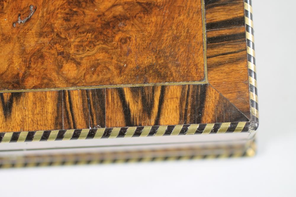A VICTORIAN BURR WALNUT LAP DESK of plain oblong form crossbanded in coromandel and strung in brass Image