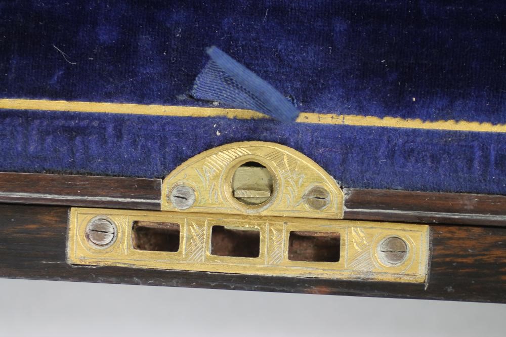 A VICTORIAN BURR WALNUT LAP DESK of plain oblong form crossbanded in coromandel and strung in brass Image