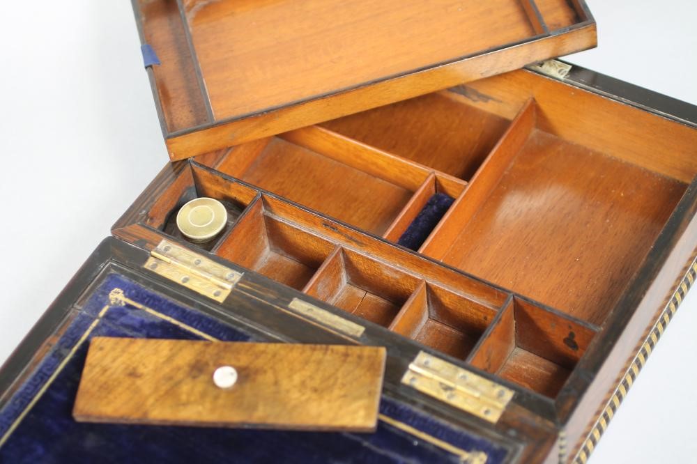 A VICTORIAN BURR WALNUT LAP DESK of plain oblong form crossbanded in coromandel and strung in brass Image