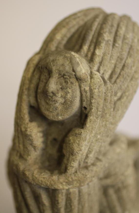 A LIMESTONE CARVING of a medieval monk Image