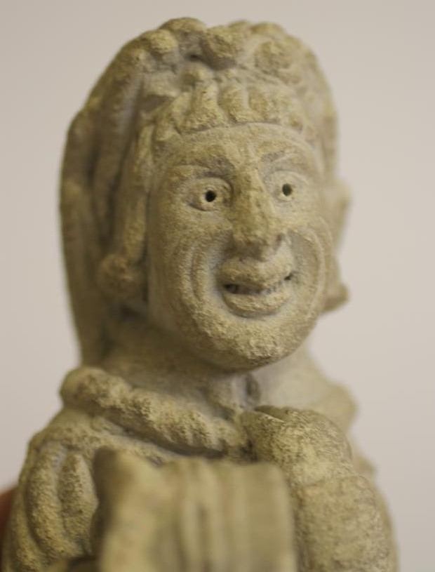 A LIMESTONE CARVING of a medieval monk Image