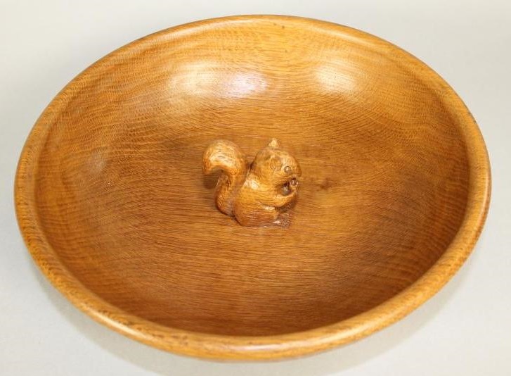 A WILF HUTCHINSON ADZED OAK FRUIT BOWL of deep circular form with carved squirrel trademark in high Image
