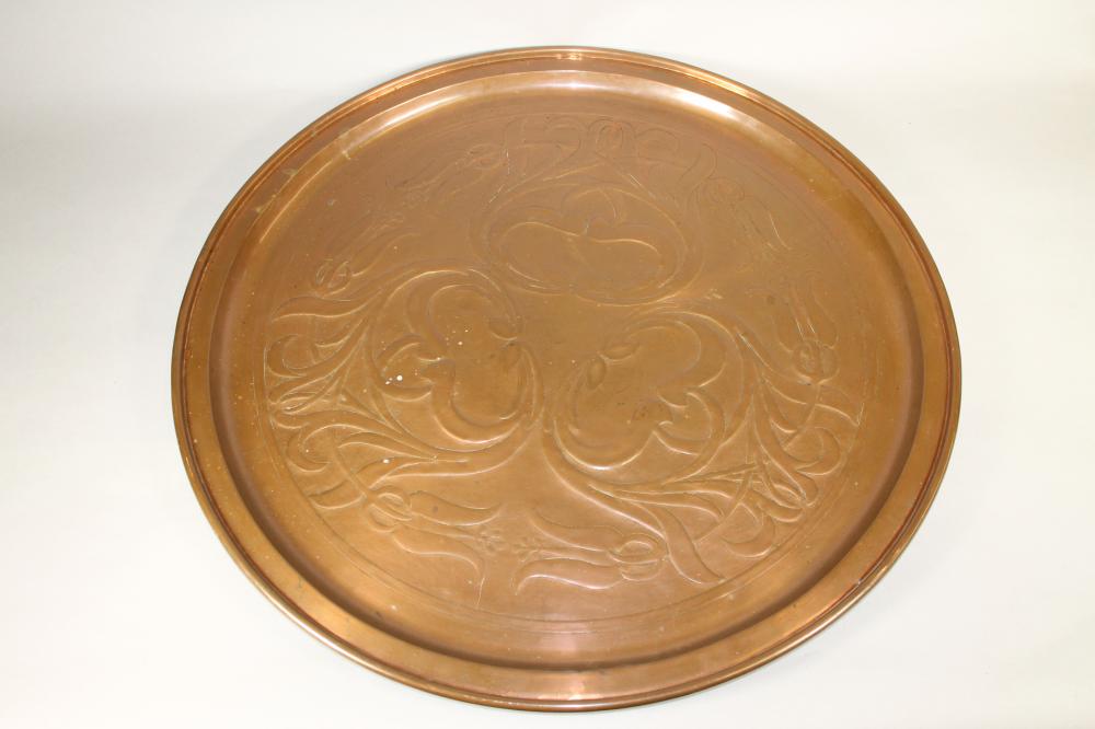 A KESWICK SCHOOL ARTS AND CRAFTS COPPER PLAQUE of plain circular form Image