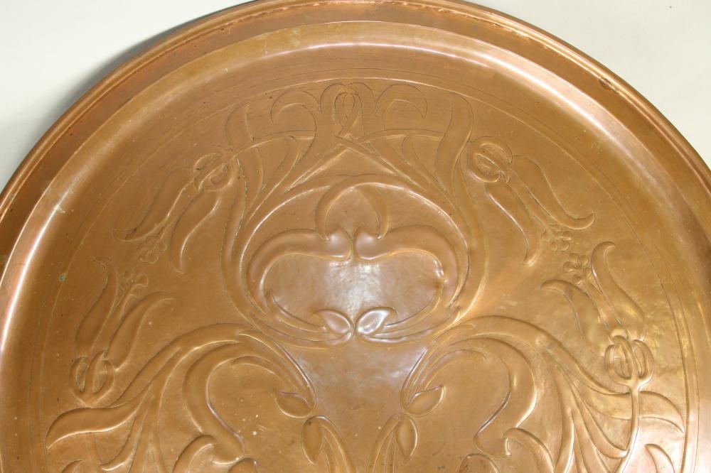 A KESWICK SCHOOL ARTS AND CRAFTS COPPER PLAQUE of plain circular form Image