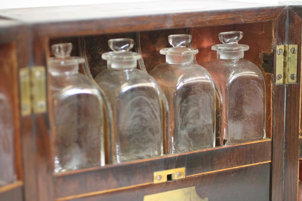 A ROSEWOOD AND BRASS BOUND TRAVELLING MEDICINE CHEST Image