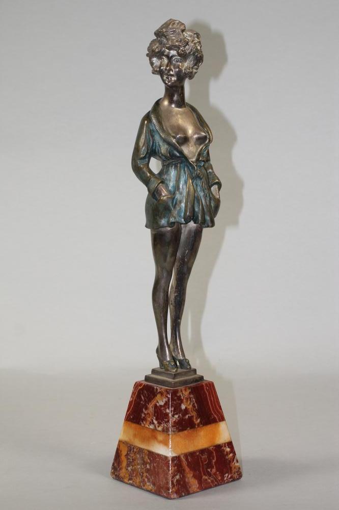 AN ART DECO COLD PAINTED SILVERED METAL FIGURE Image