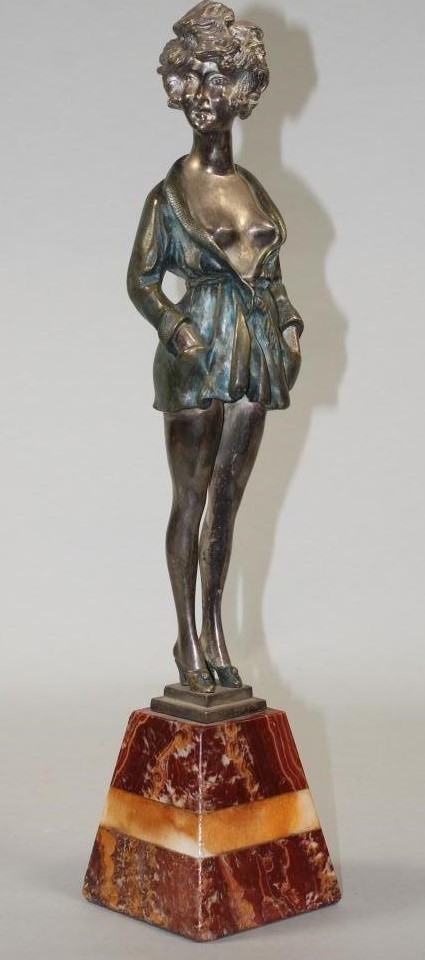 AN ART DECO COLD PAINTED SILVERED METAL FIGURE Image