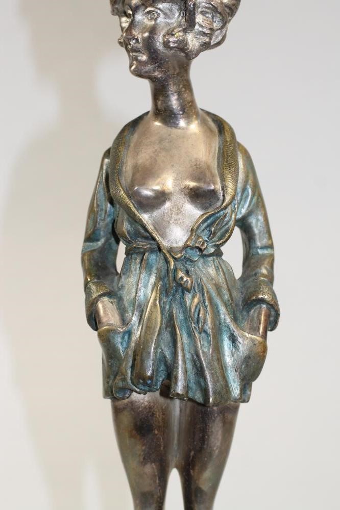 AN ART DECO COLD PAINTED SILVERED METAL FIGURE Image