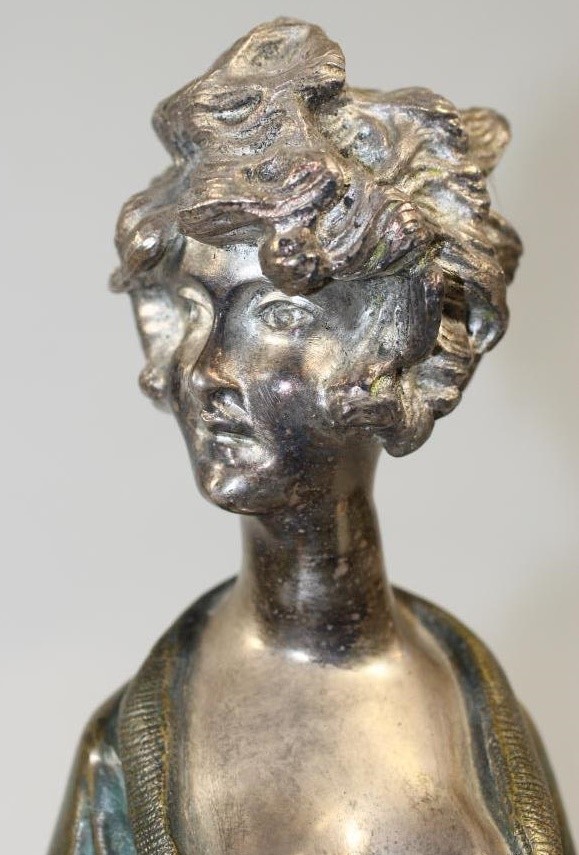 AN ART DECO COLD PAINTED SILVERED METAL FIGURE Image