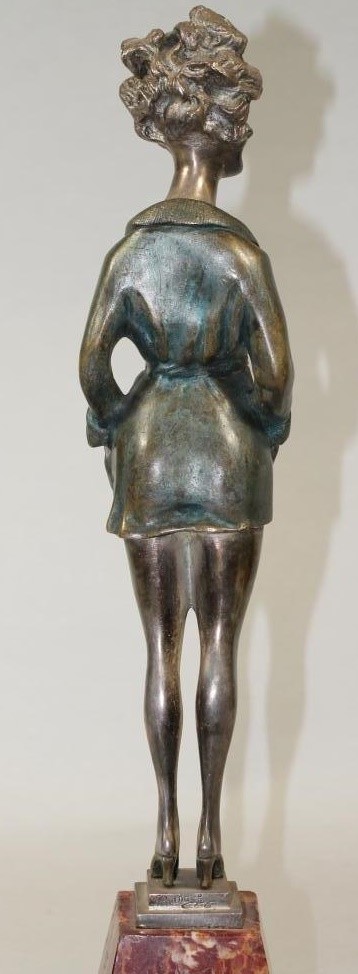 AN ART DECO COLD PAINTED SILVERED METAL FIGURE Image