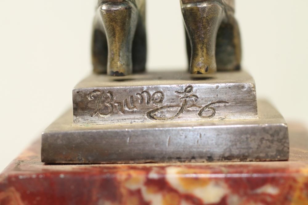 AN ART DECO COLD PAINTED SILVERED METAL FIGURE Image