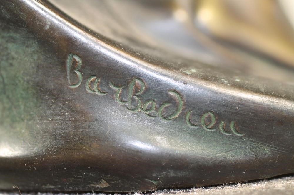 AN ART DECO BRONZED FIGURE of a semi naked young woman wearing an Egyptianesque head-dress in her Image