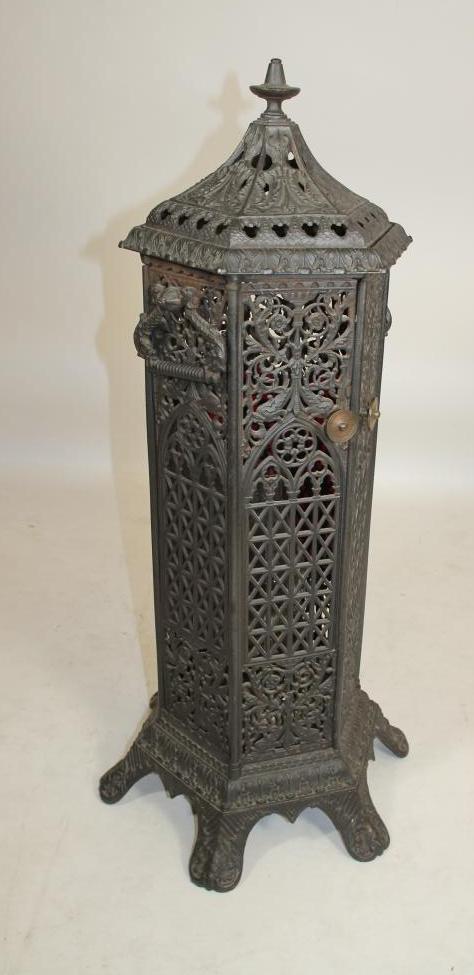 A VICTORIAN CAST IRON "CATHEDRAL" STOVE Image