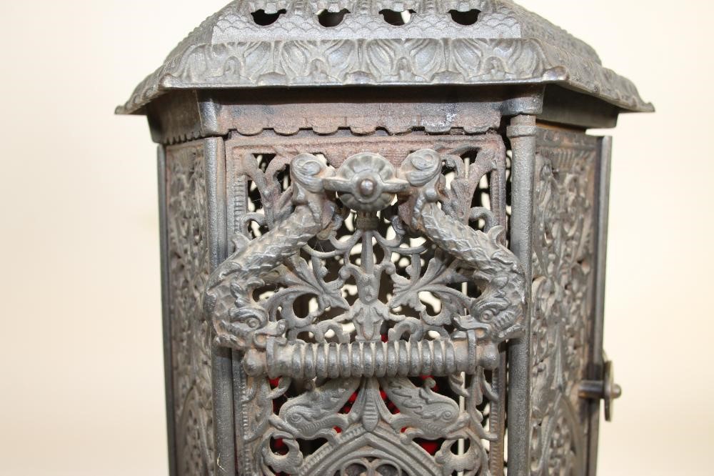 A VICTORIAN CAST IRON "CATHEDRAL" STOVE Image