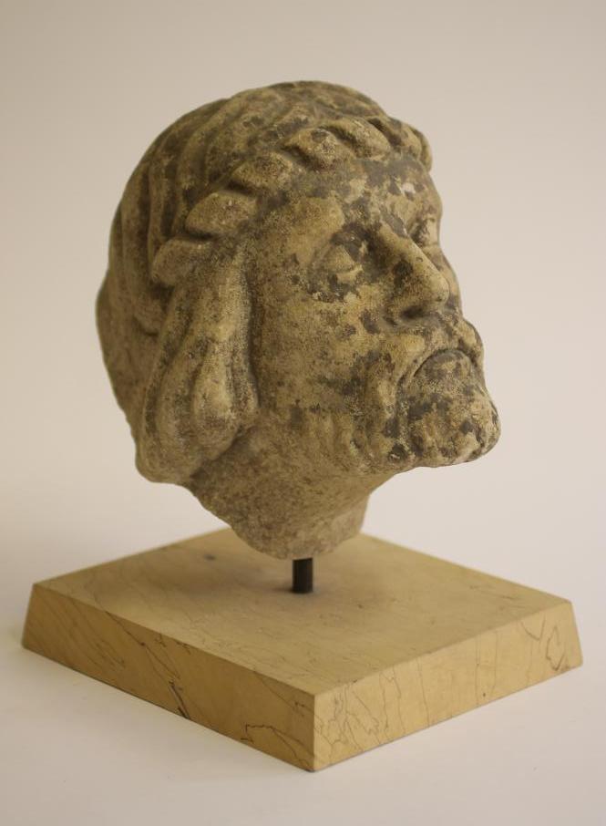 A CARVED OOLITIC LIMESTONE BUST Image