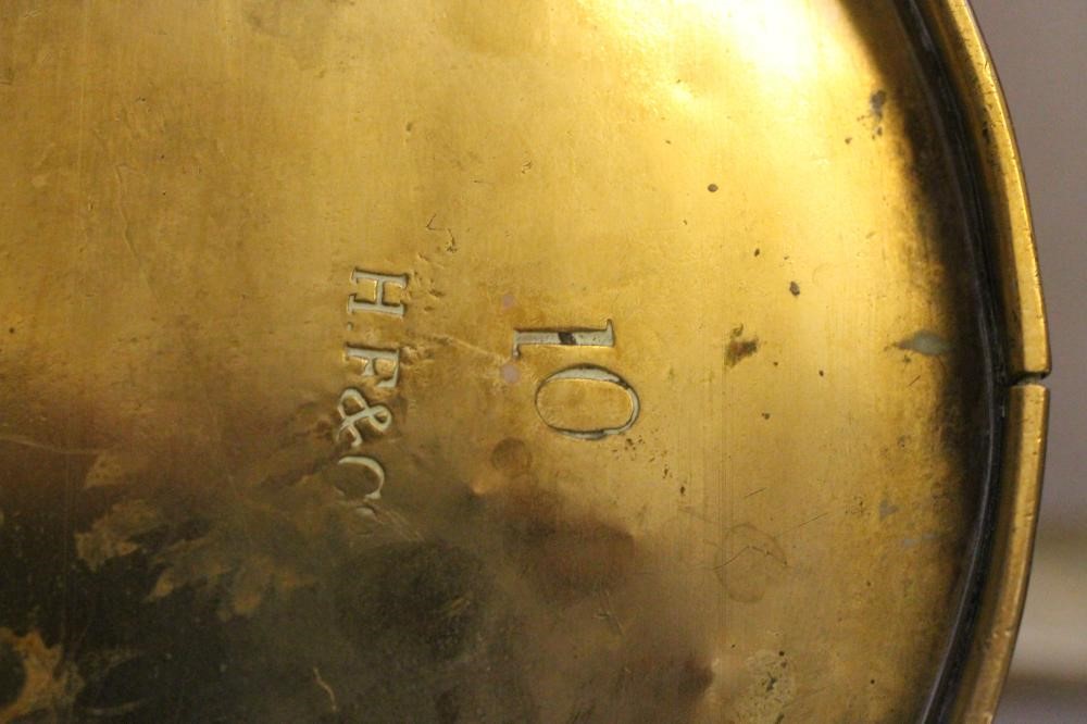 A VICTORIAN BRASS WATERING CAN of oval form with ribbed banding Image