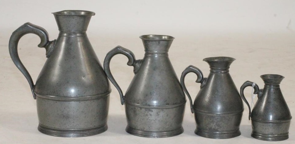 A SET OF FOUR IRISH PEWTER MEASURES Image