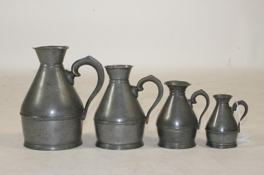 A SET OF FOUR IRISH PEWTER MEASURES Image