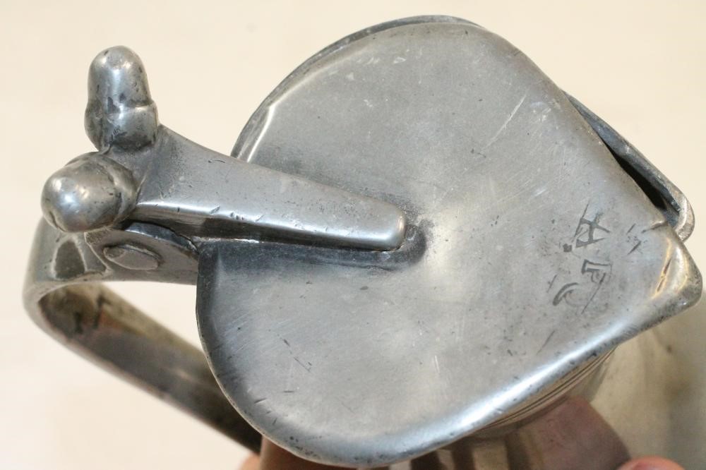 A FRENCH PEWTER WINE MEASURE Image