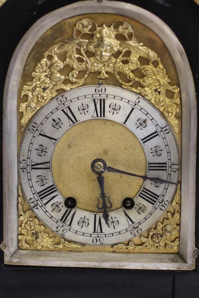 AN EBONIZED AND GILT METAL MOUNTED TABLE CLOCK of Georgian design Image