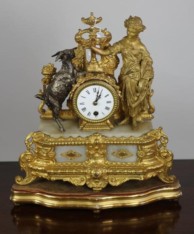 A FRENCH GILT METAL AND ALABASTER TIMEPIECE Image
