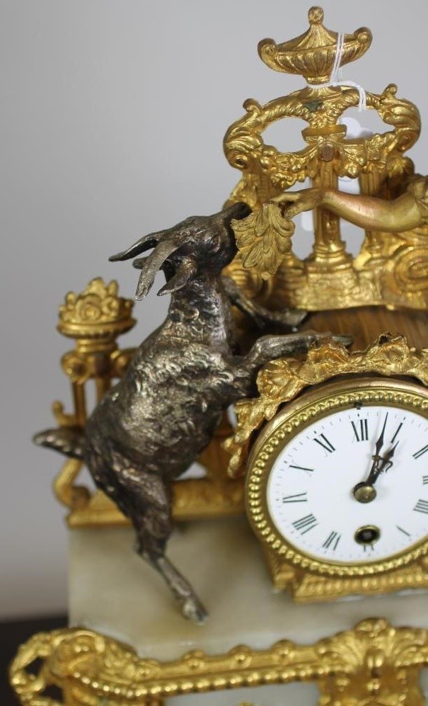 A FRENCH GILT METAL AND ALABASTER TIMEPIECE Image