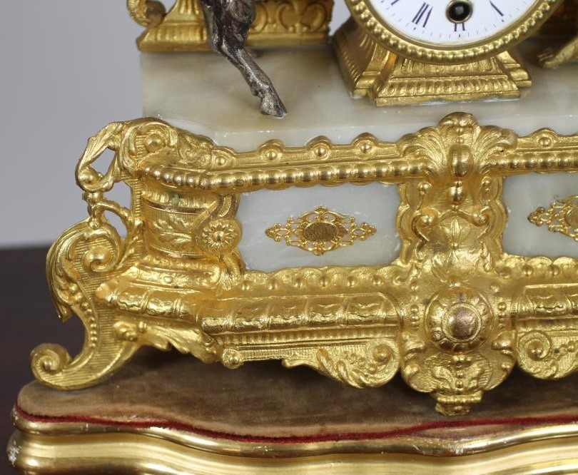 A FRENCH GILT METAL AND ALABASTER TIMEPIECE Image
