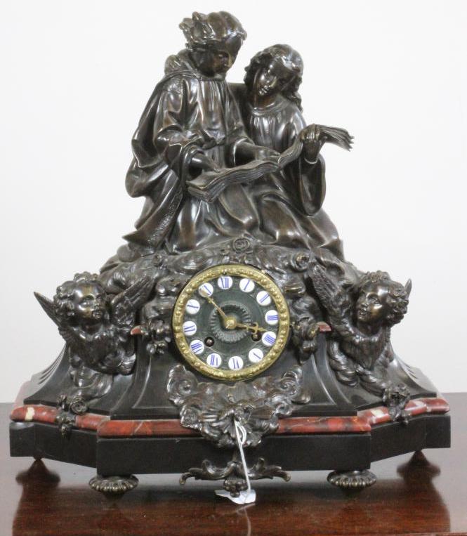 A FRENCH BRONZE AND MARBLE MANTEL CLOCK Image