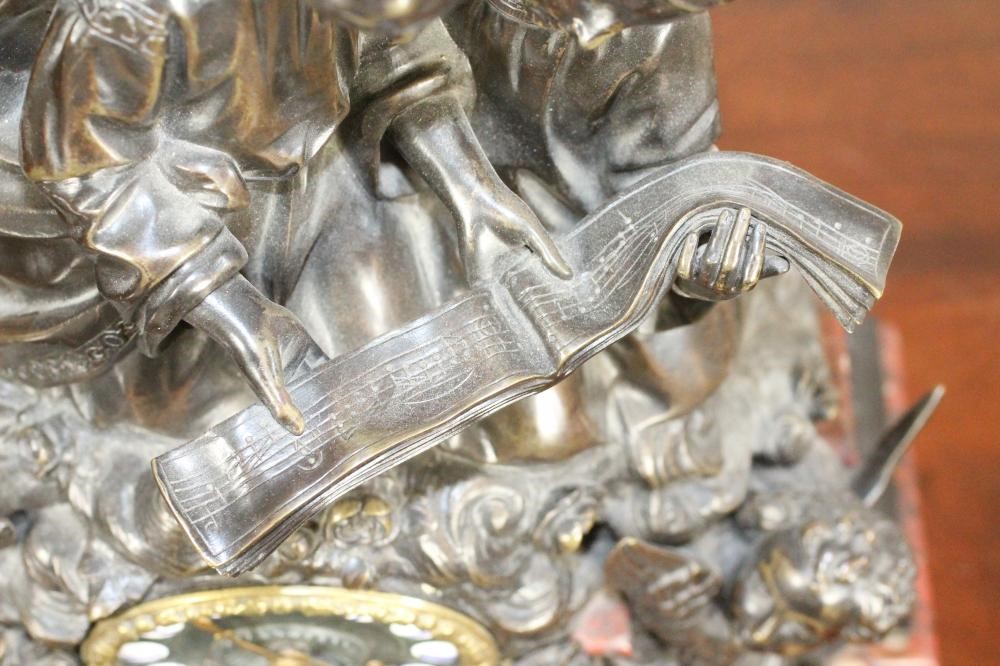 A FRENCH BRONZE AND MARBLE MANTEL CLOCK Image