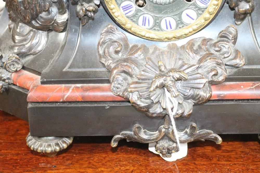 A FRENCH BRONZE AND MARBLE MANTEL CLOCK Image