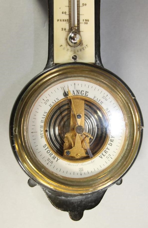A VICTORIAN EBONISED WALL CLOCK with barometer Image