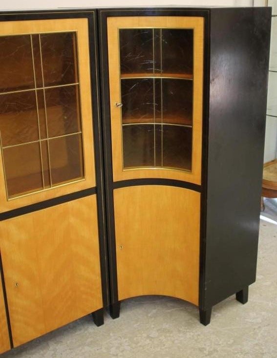 A SATINWOOD AND EBONISED DISPLAY CABINET by Muster Mobler Image