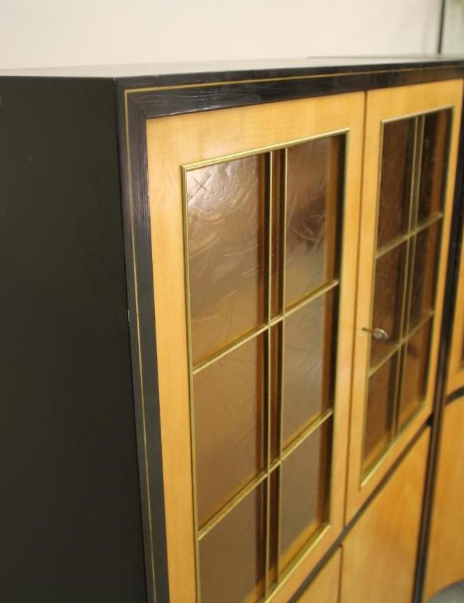 A SATINWOOD AND EBONISED DISPLAY CABINET by Muster Mobler Image