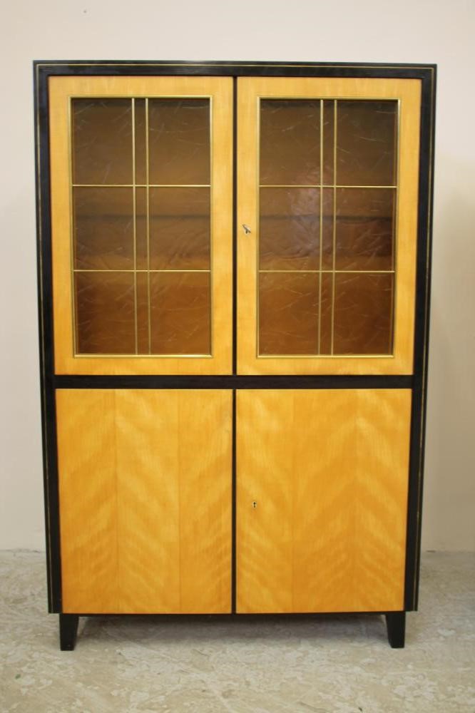 A SATINWOOD AND EBONISED DISPLAY CABINET by Muster Mobler Image