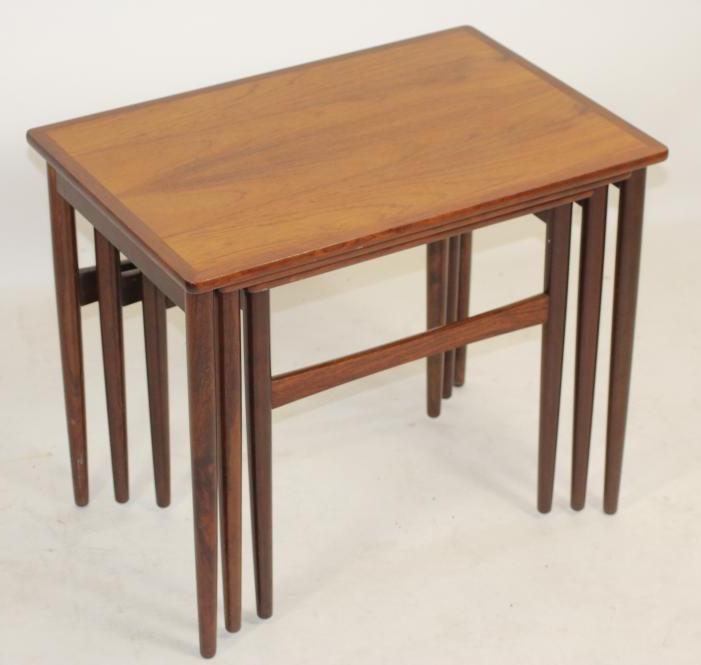 A NEST OF THREE TEAK TABLES Image