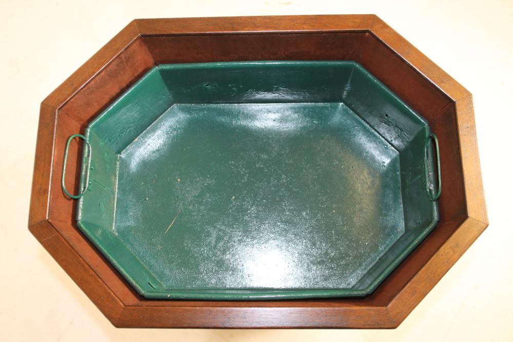 A GEORGIAN DESIGN MAHOGANY AND BRASS BOUND CELLARETTE of canted oblong form with brass loop handles Image