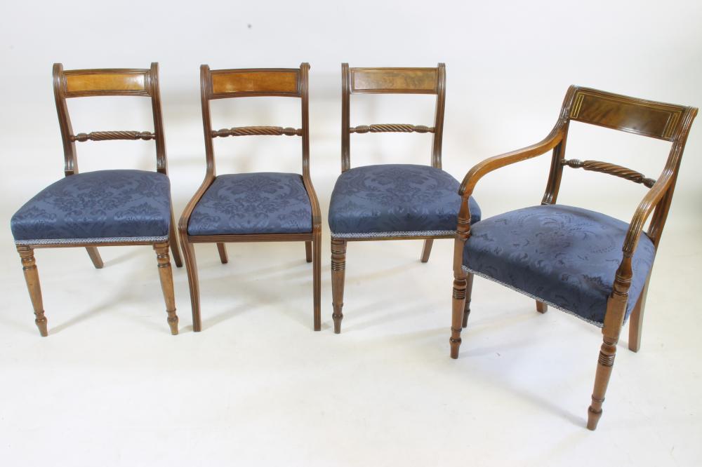 A COMPOSITE SET OF TWELVE REGENCY MAHOGANY DINING CHAIRS covered in deep blue damask and comprising Image