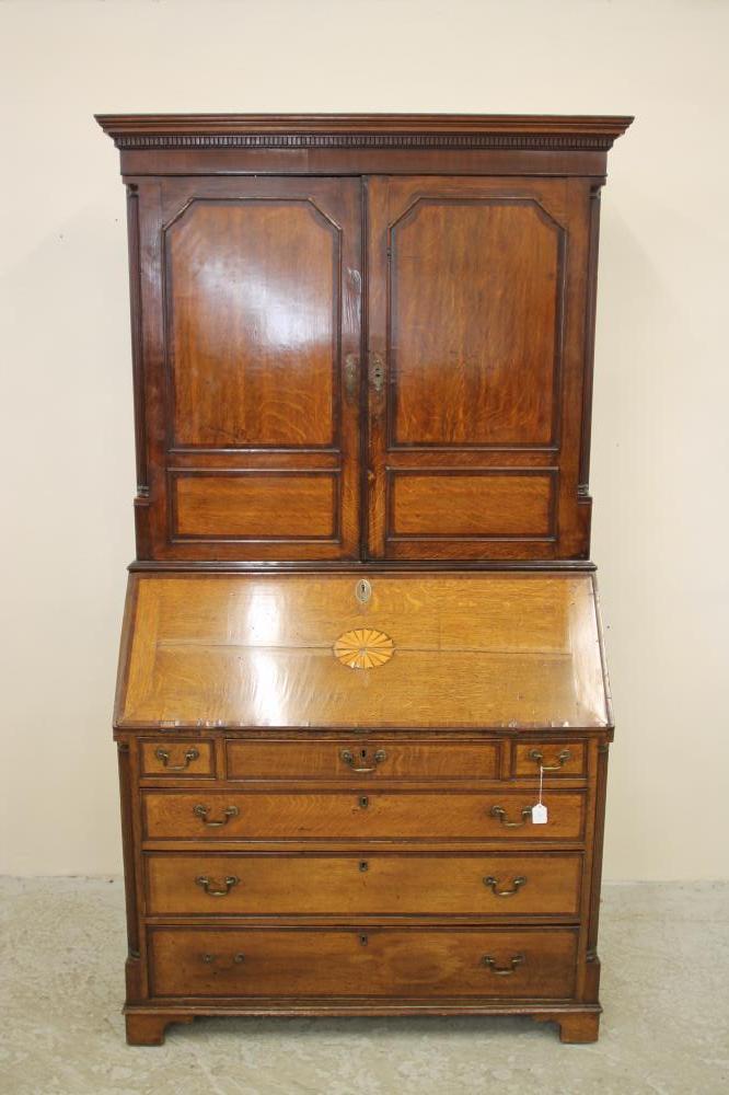 A GEORGIAN OAK AND MAHOGANY BANDED BUREAU CABINET Image