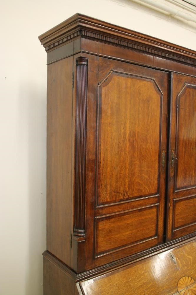 A GEORGIAN OAK AND MAHOGANY BANDED BUREAU CABINET Image