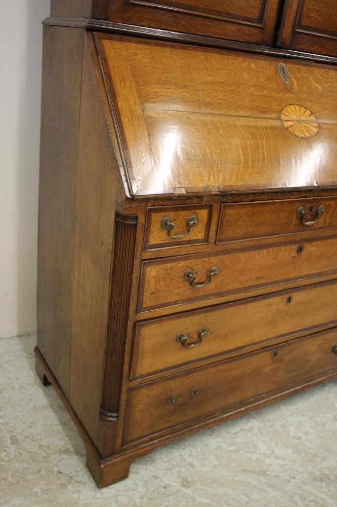 A GEORGIAN OAK AND MAHOGANY BANDED BUREAU CABINET Image