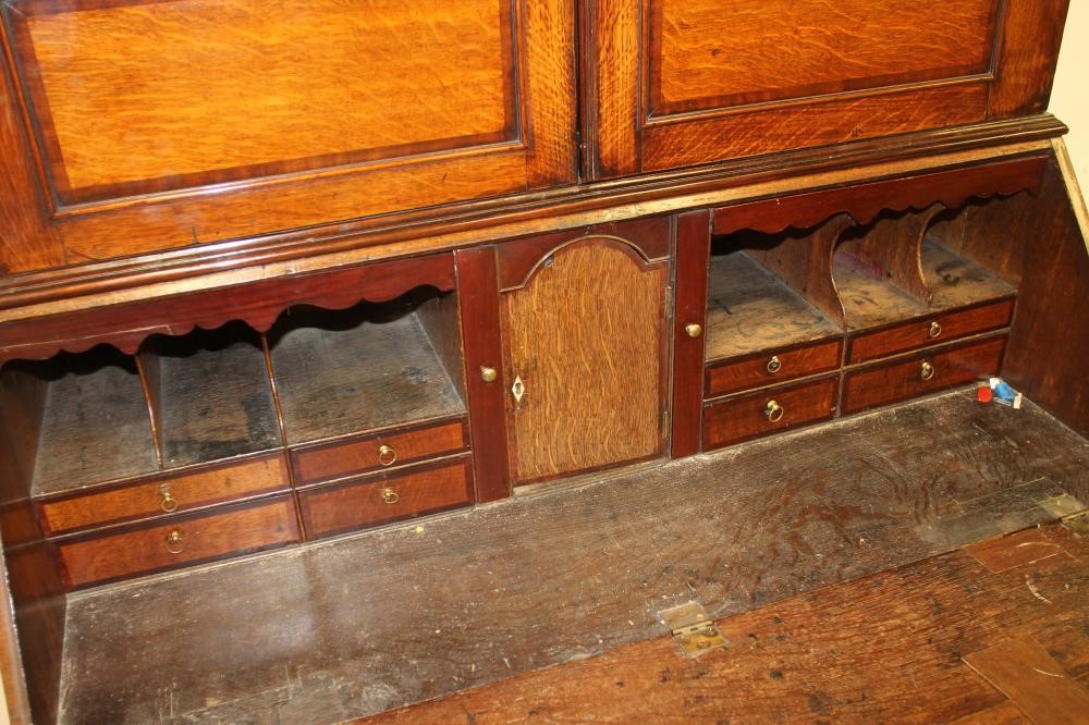 A GEORGIAN OAK AND MAHOGANY BANDED BUREAU CABINET Image