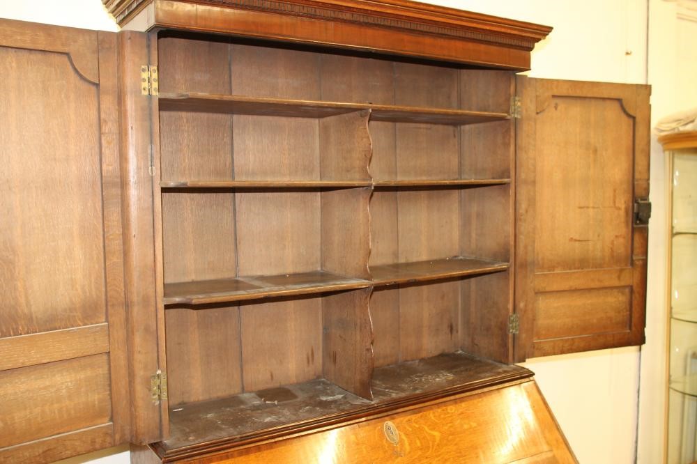 A GEORGIAN OAK AND MAHOGANY BANDED BUREAU CABINET Image