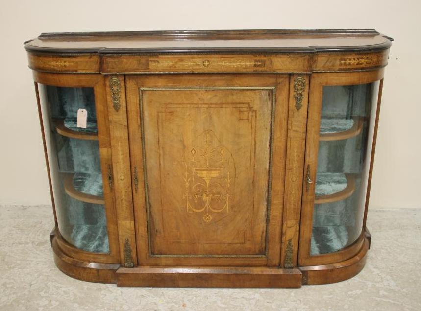 A VICTORIAN WALNUT AND EBONISED CREDENZA of breakfront D form with stringing and gilt metal mounts Image